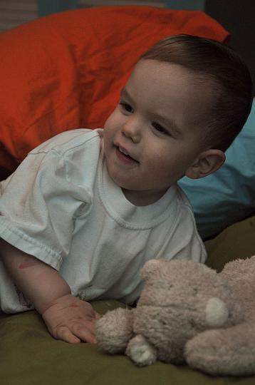 Jackson playing on the bed