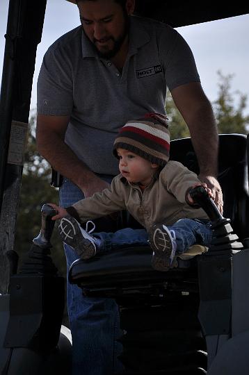 Jackson driving the arm of the tractor