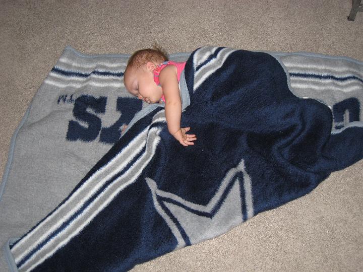 Paige Cathey sleeping on Cowboys blanket